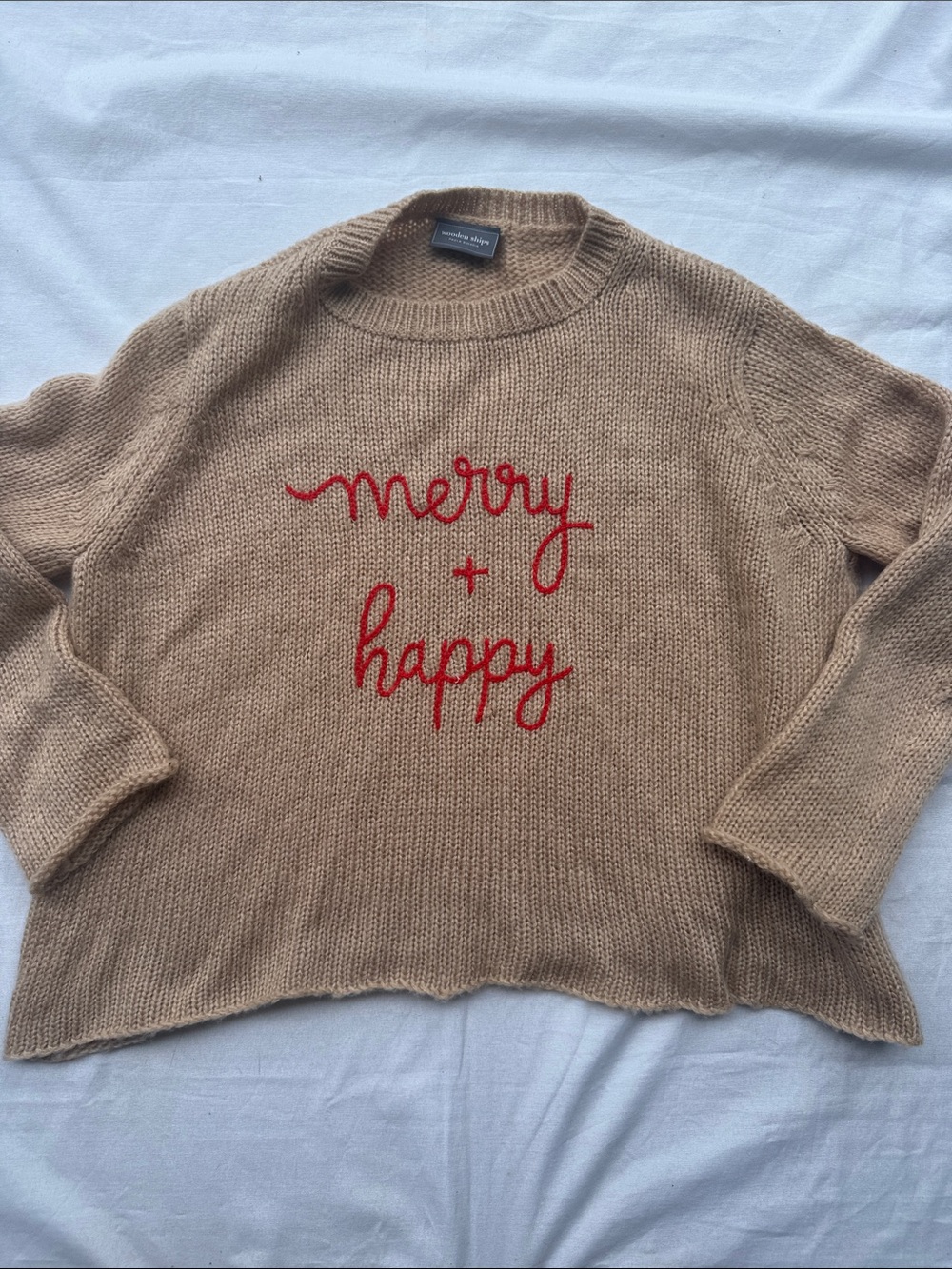 Wooden Ships Tan Knit Sweater with Red 'merry + happy' Script